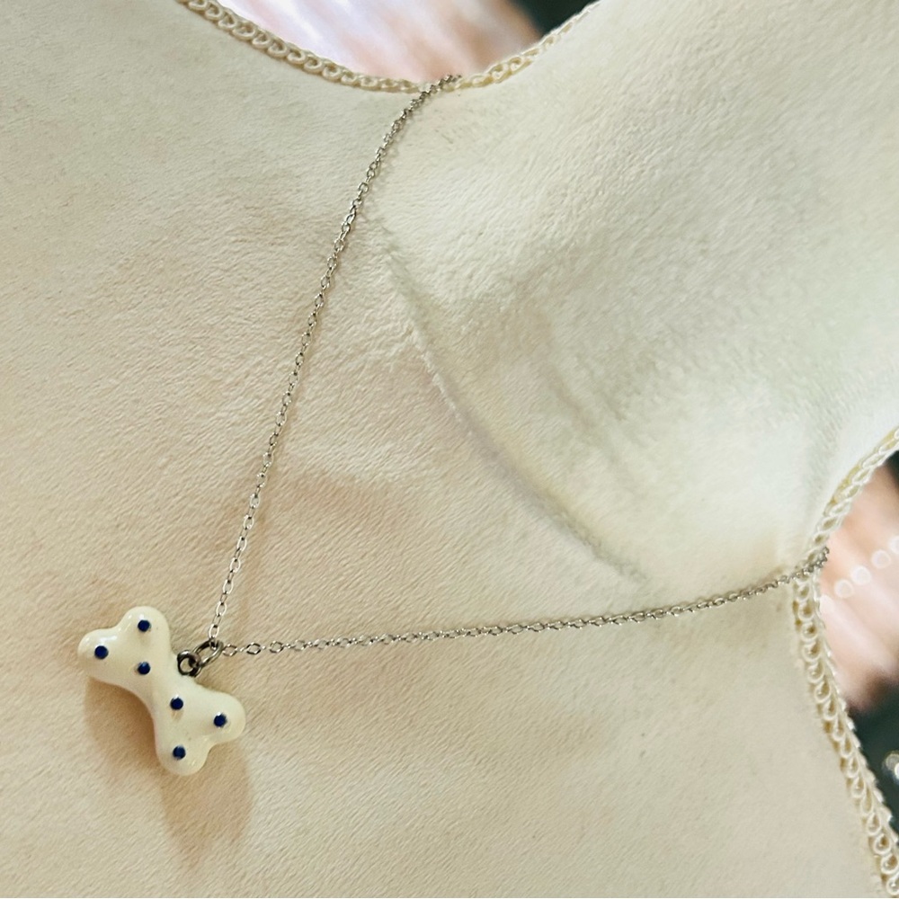 Ivory enamel solid metal dog bone pendant on chain necklace